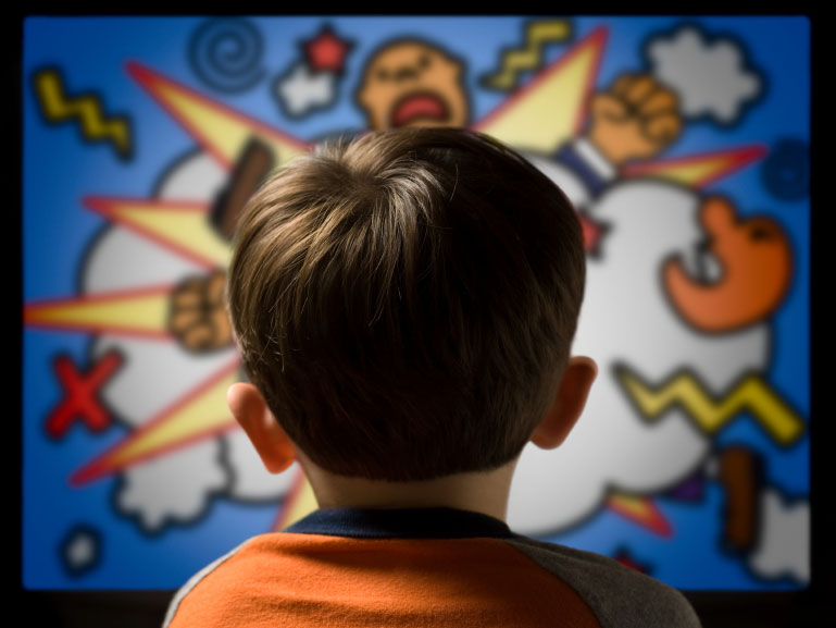 Child watching television screen.