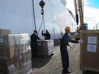 Workers loading the USNS Comfort.
