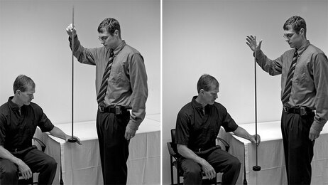 Concussion test: hockey puck on a stick.