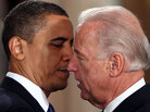 Vice President Joe Biden whispers into President Obama's ear. Vice President Joe Biden whispers into President Obama's ear.