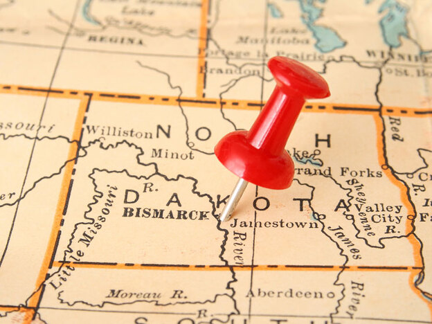 Nebraska map with a pushpin.