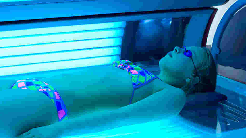 Girl tans indoors. Girl tans indoors.