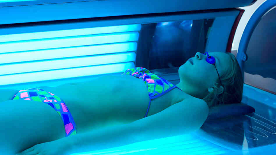 Girl tans indoors. Girl tans indoors.