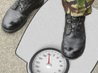 Solider stands on scale. Solider stands on scale.