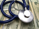 money and a stethoscope money and a stethoscope