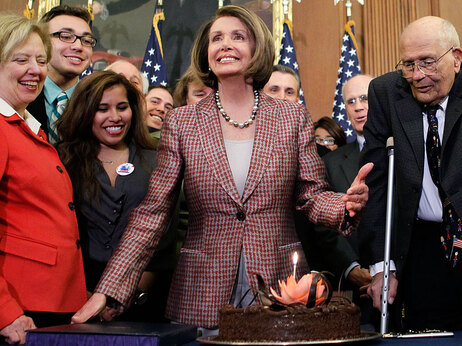 House Speaker Nancy Pelosi celebrates her birthday and the signing of the new health law with a big chocolate cake on March 26.