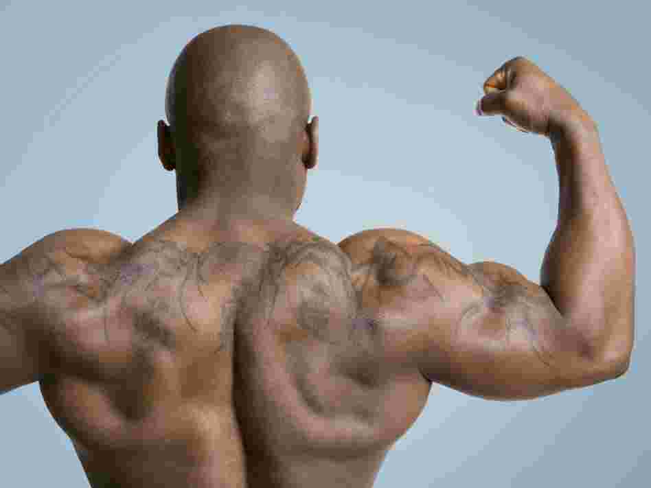 body builder flexes muscle