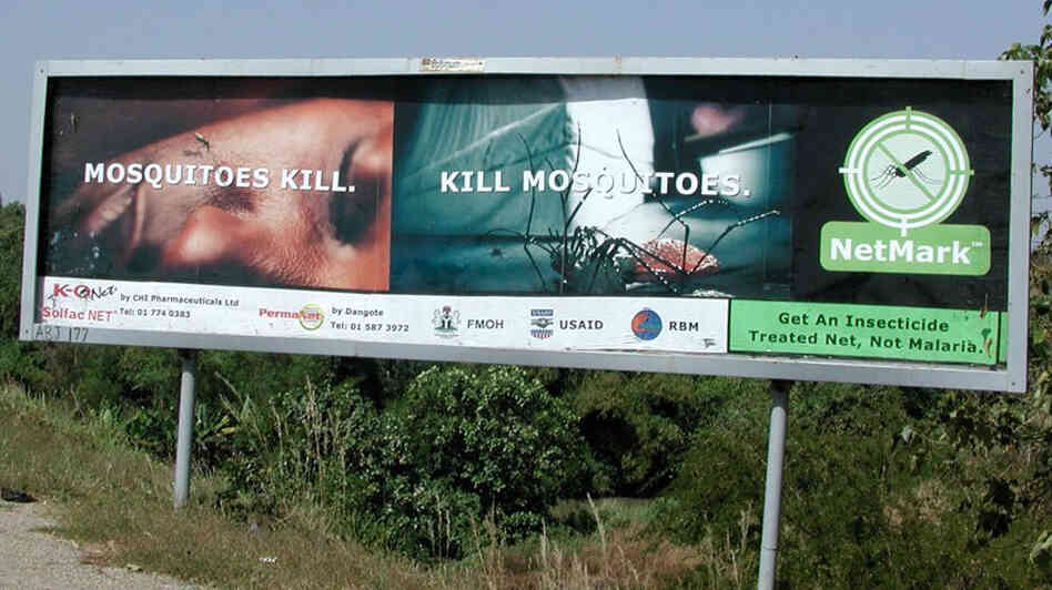 Roadside billboard in Nigeria promotes insecticide-treated nets for malaria prevention.