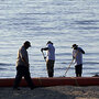 Clean-up workers on a Louisiana beach. Clean-up workers on a Louisiana beach.