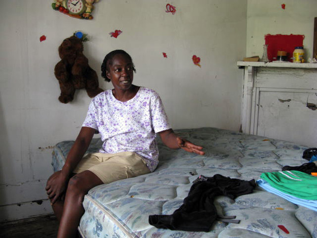 Alondis "Peaches" Jackson sits on a mattress in the abandoned New Orleans home where she squats