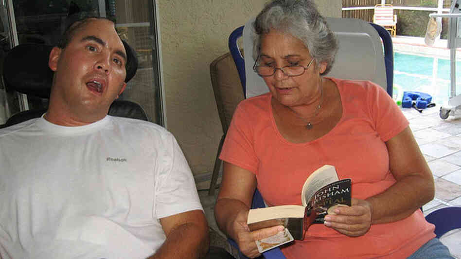 Nellie Bagley reads to her son Jose Pequeno at their Tampa home. Credit: Daniel Zwerdling, NPR. Nellie Bagley reads to her son Jose Pequeno at their Tampa home. Credit: Daniel Zwerdling, NPR.