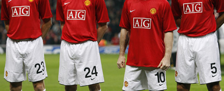 Manchester United football team wearing AIG shirts.