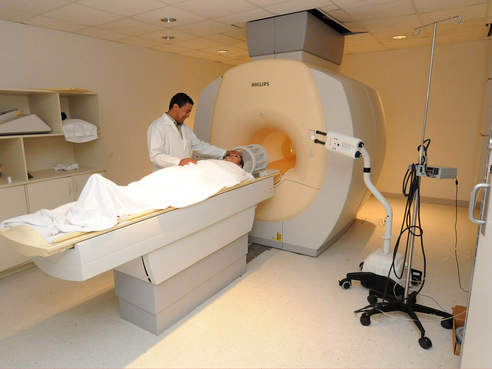 A patient heads into an MRI machine.