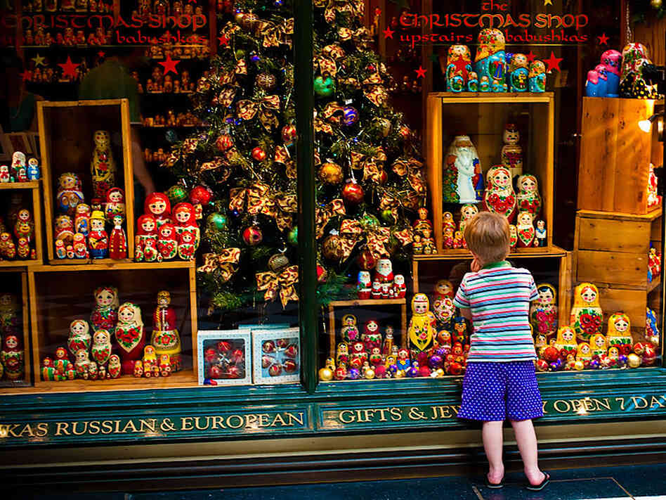 A child stands outside a Christmas shop in Australia