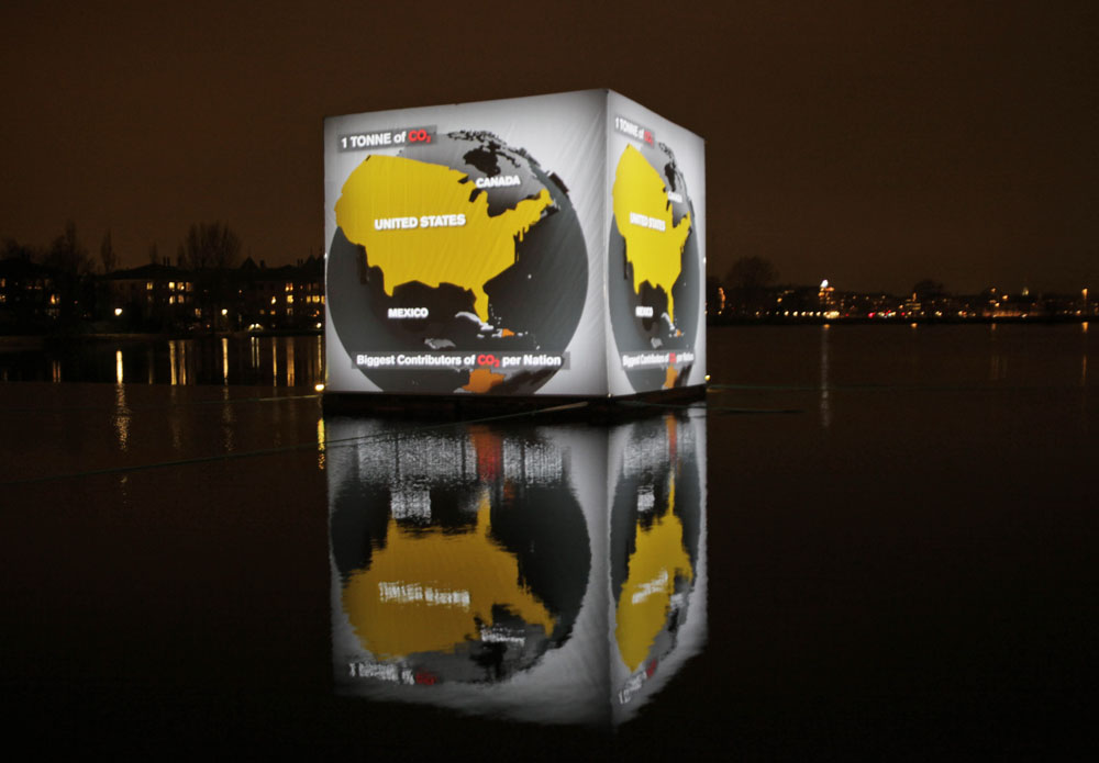 A floating cube in Copenhagen shows video from the current Climate Conference