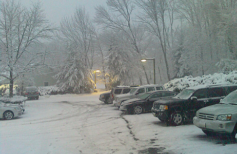 A snow covered parking lot.