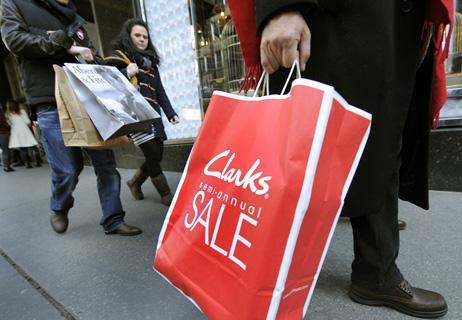 Shoppers walk down Lexington Avenue