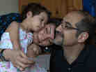This is a family photo taken prior to Kian's arrest. Tajbaksh is seen here with his wife, Bahar, and