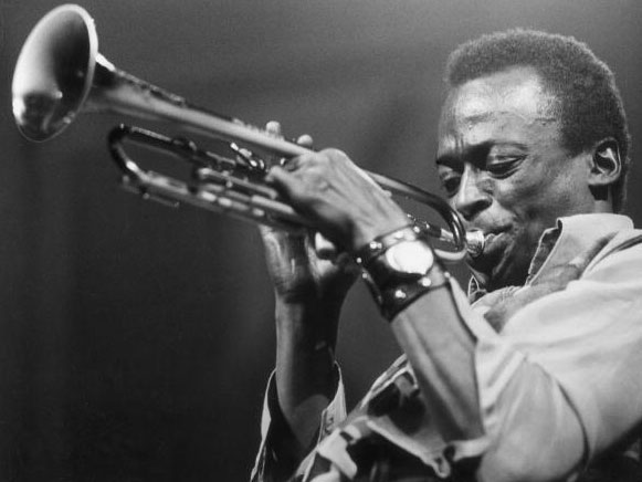 Miles Davis playing the trumpet.