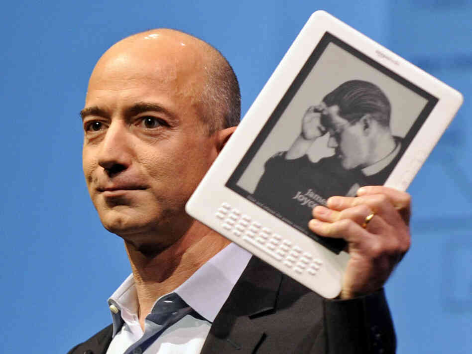 Amazon CEO Jeff Bezos and a Kindle. Emmanuel Dunand/AFP/Getty Images Amazon CEO Jeff Bezos and a Kindle. Emmanuel Dunand/AFP/Getty Images