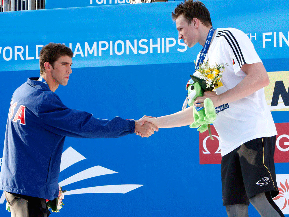 Germany's Paul Biedermann, right, shakes hands with Michael Phelps of the United States AP Photo/Michael Sohn 