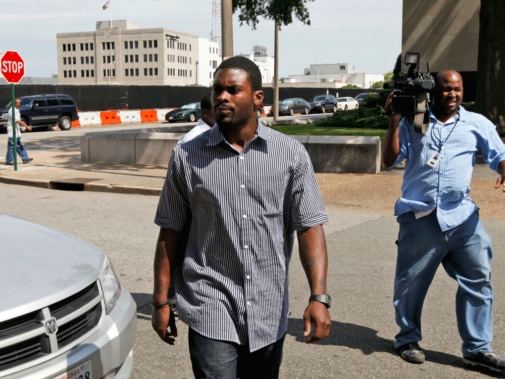 Former Atlanta Falcon quarterback, Michael Vick, leaves federal court Monday, July 20, 2009.  Credit: AP Photo/Steve Helber.