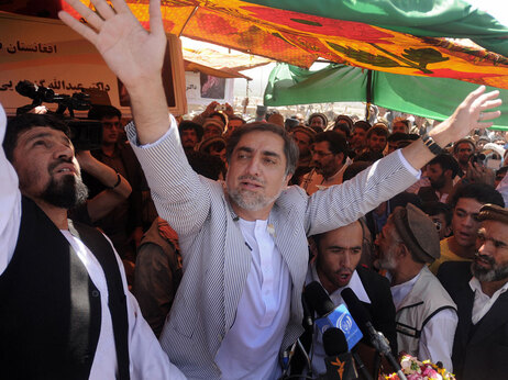 Abdullah Abdullah, one of the 41 candidates for the upcoming Afghan presidential election, waves to his supporters in Charikar city of Parwan province, north of Kabul on July 26, 2009. Afghanistan's presidential election is on Aug. 20. Massoud Hossaini/AFP/Getty Images.