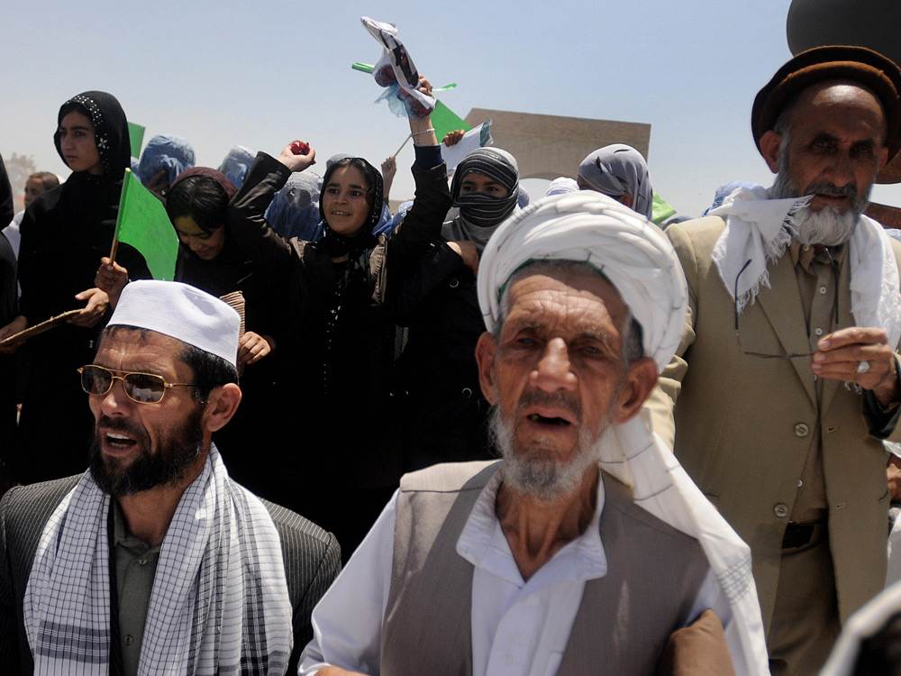  Supporters of presidential candidate Abdullah Abdullah at a campaign event in Charikar city of Parwan province, north of Kabul on July 26, 2009. Credit: MASSOUD HOSSAINI/AFP/Getty Images.