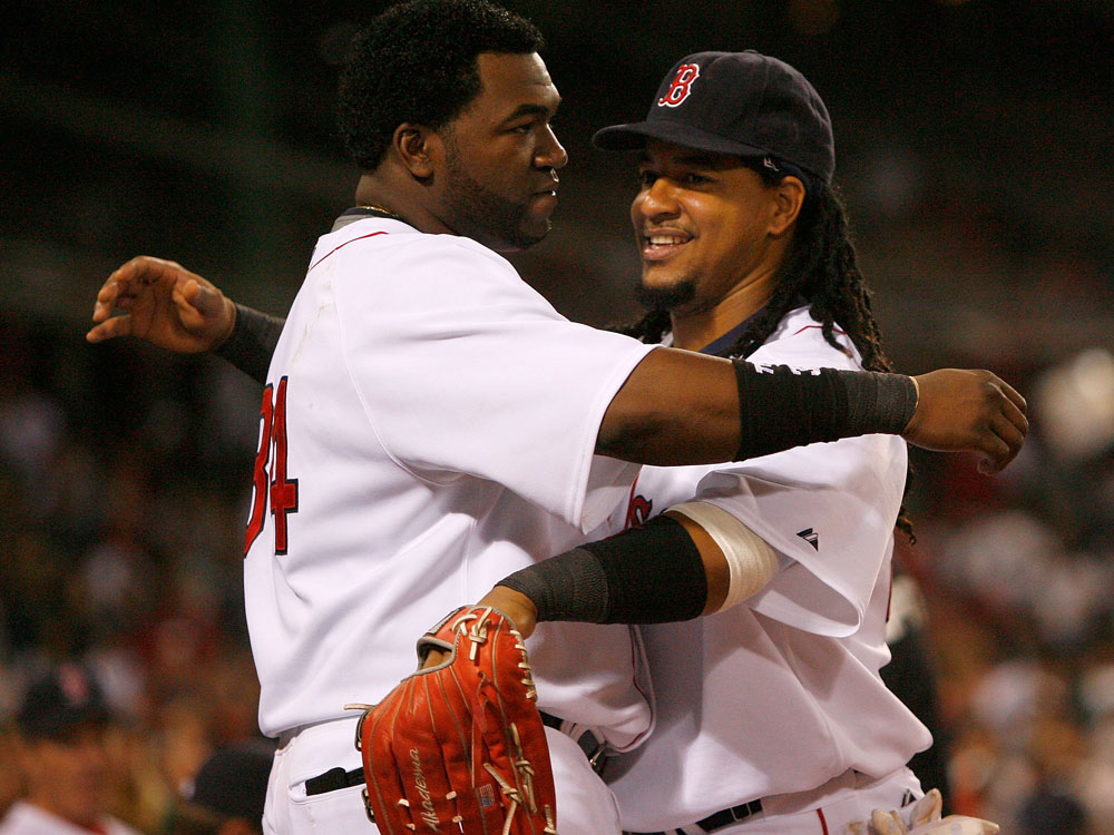  David Ortiz #34 and Manny Ramirez #24 of the Boston Red Sox embrace during a game with the New York Yankees at Fenway Park on July 27, 2008 in Boston, Massachusetts. (Photo by Jim Rogash/Getty Images)