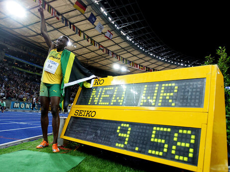 Usain Bolt of Jamaica celebrates winning the gold medal in the men's 100 Meters Final during day two of the 12th IAAF World Athletics Championships at the Olympic Stadium on August 16, 2009 in Berlin, Germany. Bolt set a new World Record of 9.58. (Photo by Mark Dadswell/Getty Images)
