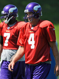 New Minnesota Vikings quarterback Brett Favre Brett Favre (4) and and teammate Tarvaris Jackson (7) look on during NFL football training camp, Tuesday, Aug. 18, 2009 in Eden Prairie, Minn. (AP Photo/Hannah Foslien)