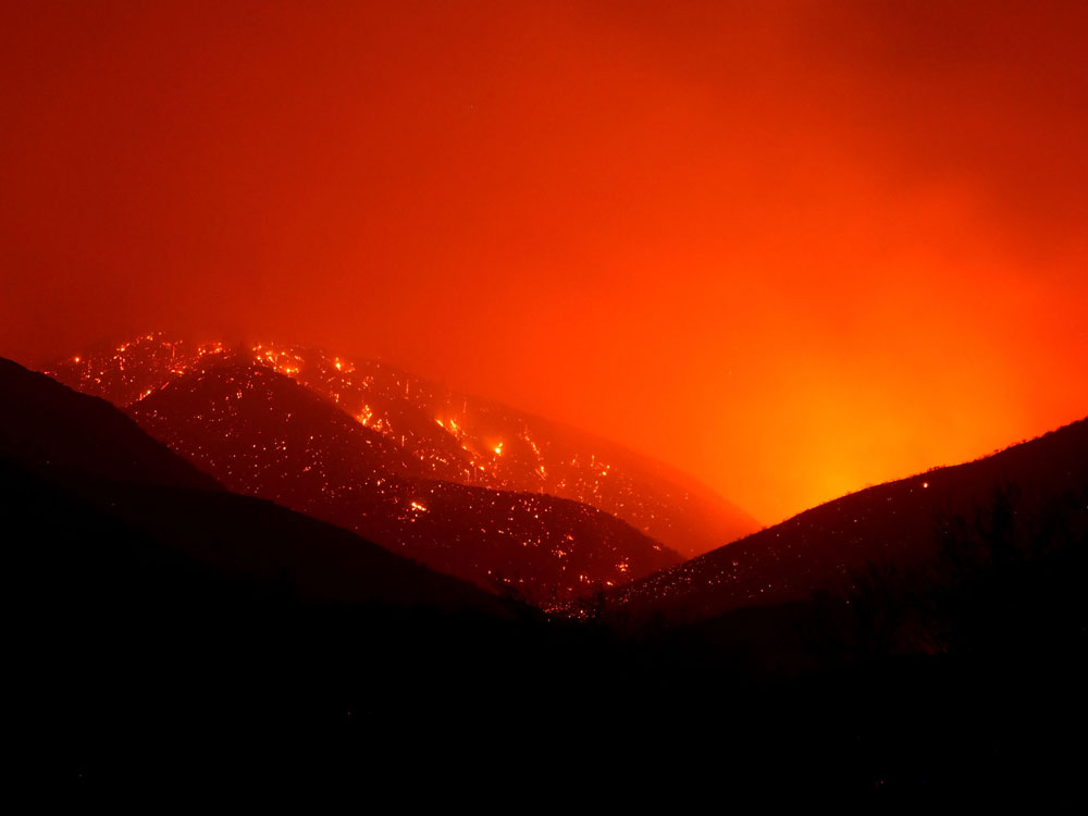ACTON, Calif. -- AUGUST 30: Spot fires glow after the Station Fire burned through August 30, 2009.  (Photo by Justin Sullivan/Getty Images) 
