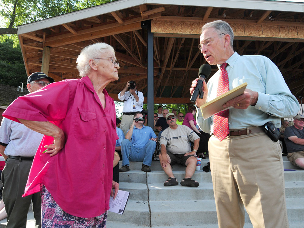 Sen. Charles Grassley, R-Iowa, answers a question from Sheryl Prather during a town meeting on health care reform Wednesday, Aug. 12, 2009 in Adel, Iowa. (AP Photo/Steve Pope)