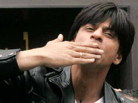 Shah Rukh Khan gestures to fans as he leaves the Grevin museum in Paris, Monday, April 28, 2008. (AP Photo/Michel Euler)