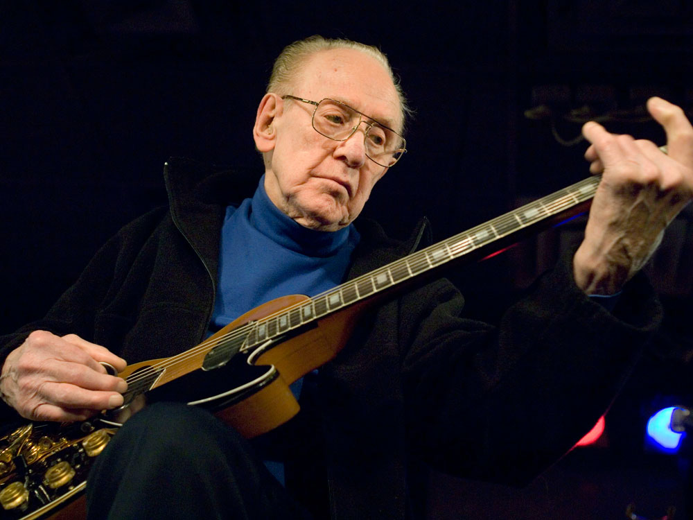 In this Feb. 26, 2007 file photo, Guitar legend Les Paul performs at the Iridium Jazz Club in New York. Paul, 94, the guitarist and inventor who changed the course of music with the electric guitar and multitrack recording and had a string of hits, died, Thursday, Aug. 13, 2009 in White Plains, N.Y. (AP Photo/ Colin Archer, file)