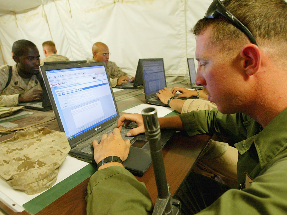 Marines with laptops.