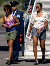 This Aug. 16, 2009 file photo shows first lady Michelle Obama and daughter Malia Obama, walking off Air Force One at Grand Canyon National Park Airport in Tusayan, Ariz. (AP Photo/Dana Felthauser)