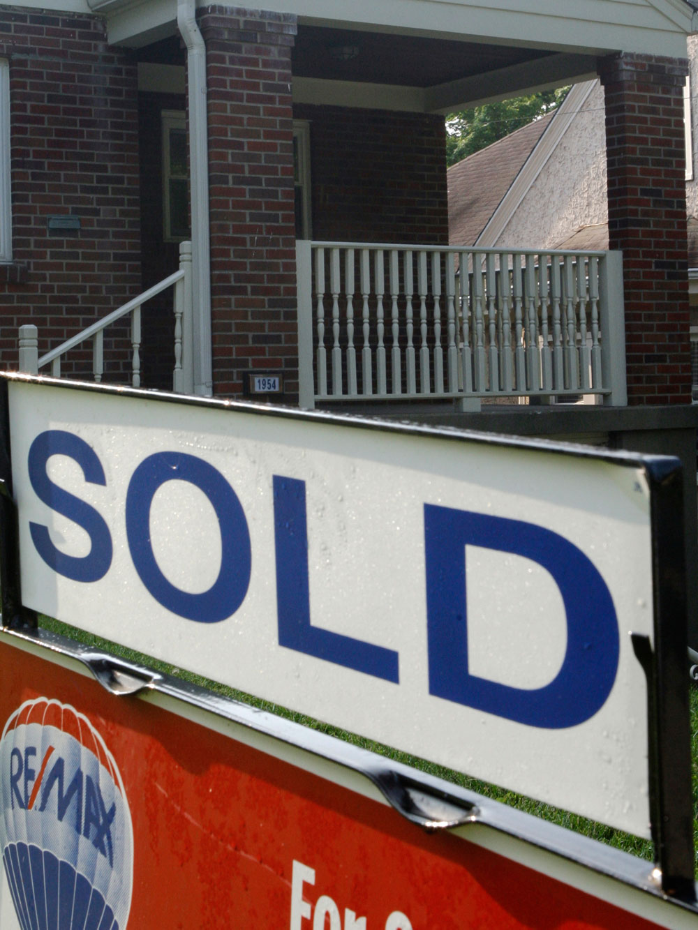 In this July 24, 2009 file photo, a sold sign is posted outside a home in Cincinnati. (AP Photo/Al Behrman)