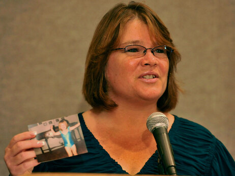Tina Dugard, aunt of recovered kidnap victim Jaycee Dugard, holds photo of her niece as a child as she read a statement at an FBI office in Los Angeles.