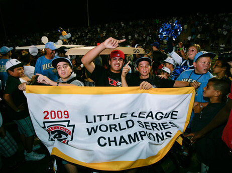 Aug. 31: Chula Vista, Calif., little league baseball players hold up a championship banner at a rally held at Southwestern College to celebrate their win in the Little League World Series Championship. The Chula Vista team beat Taoyuan, Taiwan, 6-3, in the Little League World Series championship baseball game on Aug. 30 in Williamsport, Pa. Thousands of fans turned out to celebrate the win. (AP Photo/Denis Poroy)