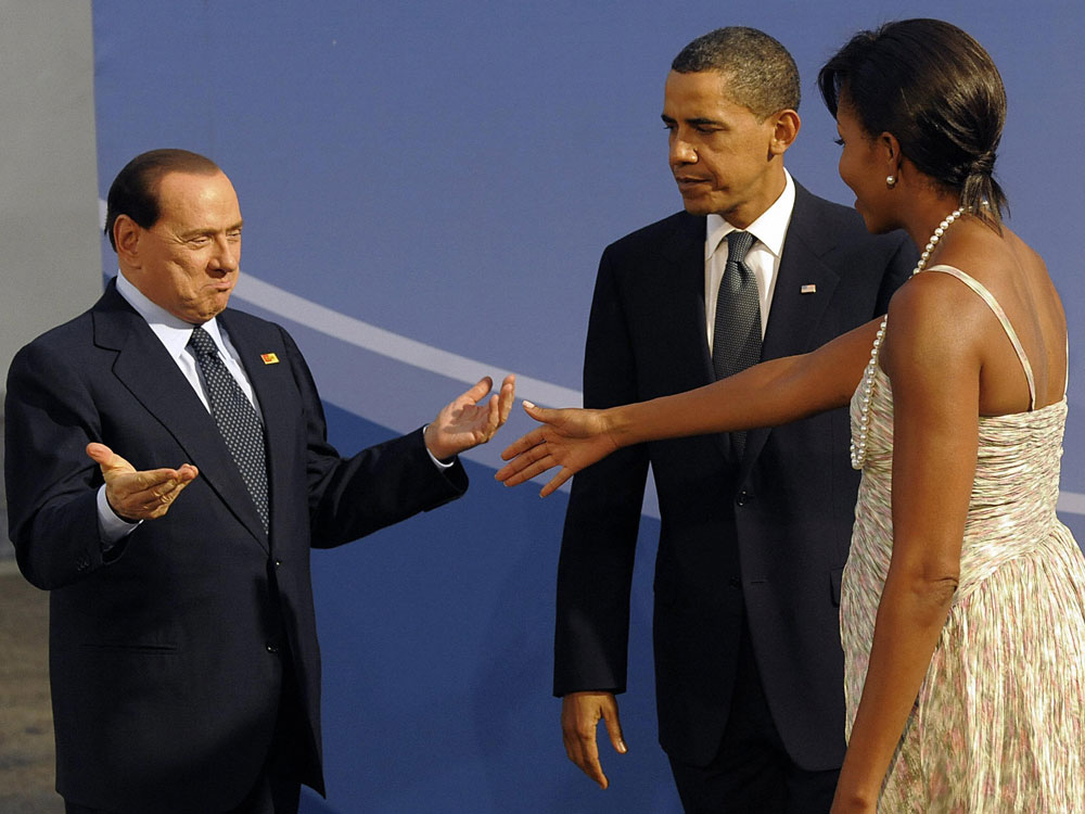  President Barack Obama and first lady Michelle Obama welcome Italian Prime Minister Silvio Berlusconi to the G20 dinner on September 24, 2009 in Pittsburgh, Pennsylvania. (Jewel Samad/AFP/Getty Images)