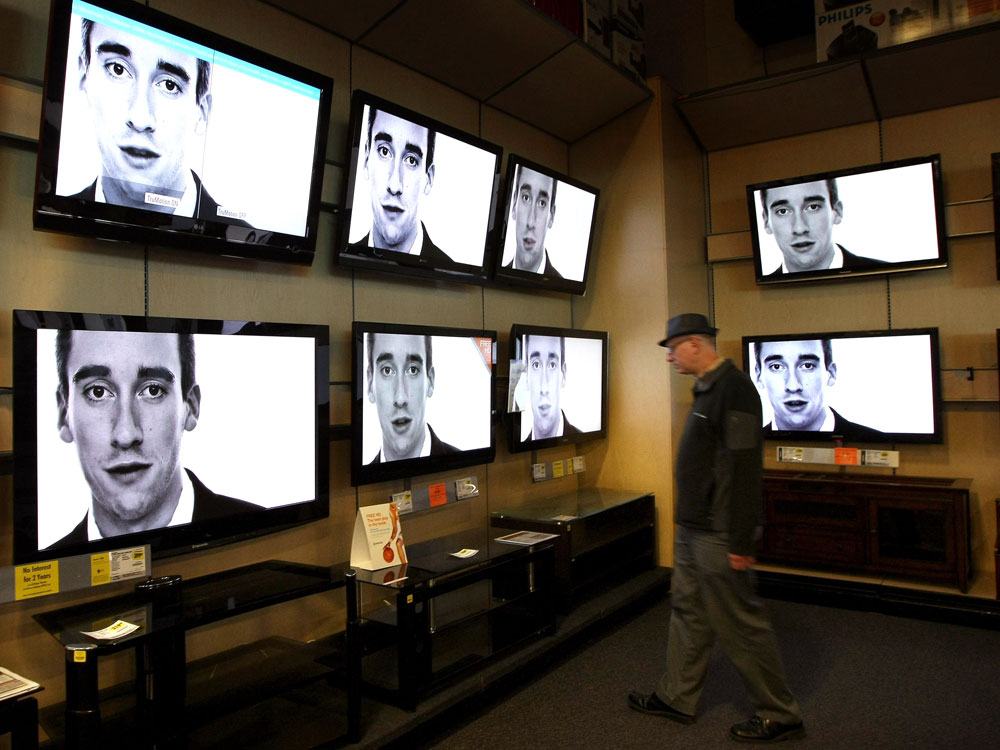 A customer looks at a display of flat screened television at a Best Buy store in San Francisco, California. California state regulators are looking to reduce the electrical draw from TVs and impose the nation's first energy limits for televisions. (Photo by Justin Sullivan/Getty Images)