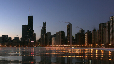 The Chicago skyline glows along Lake Michigan, February 2007(Jeff Haynes/AFP/Getty Images)