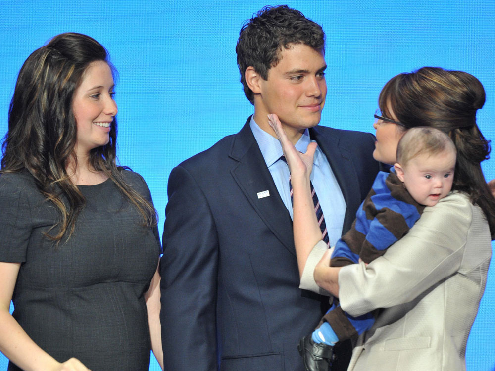 Sarah Palin (R), holding son Trig, greets daughter Bristol and her boyfriend Levi Johnston after addressing the Republican National Convention at the Xcel Energy Center in St. Paul, Minnesota, on September 3, 2008. (Paul J. Richards/AFP/Getty Images)  
