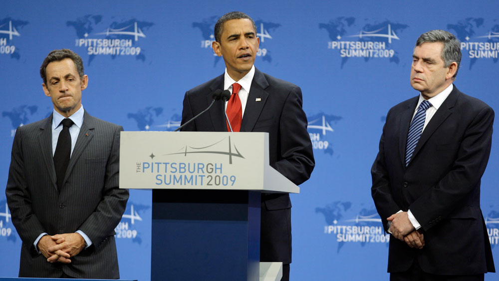 President Barack Obama, accompanied by French President Nicolas Sarkozy, left, and British Prime Minister Gordon Brown, makes a statement on Iran's nuclear facility, Friday, Sept. 25, 2009, during the G-20 summit in Pittsburgh. (AP Photo/Carolyn Kaster)