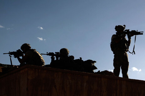 U.S. soldiers in shadows in Afghanistan.