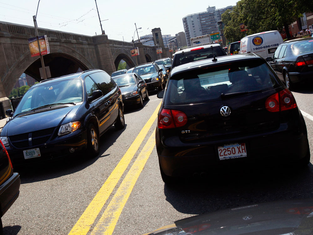 Traffic builds heading to and from downtown Boston Thursday, July 3, 2008. (AP Photo/Elise Amendola)