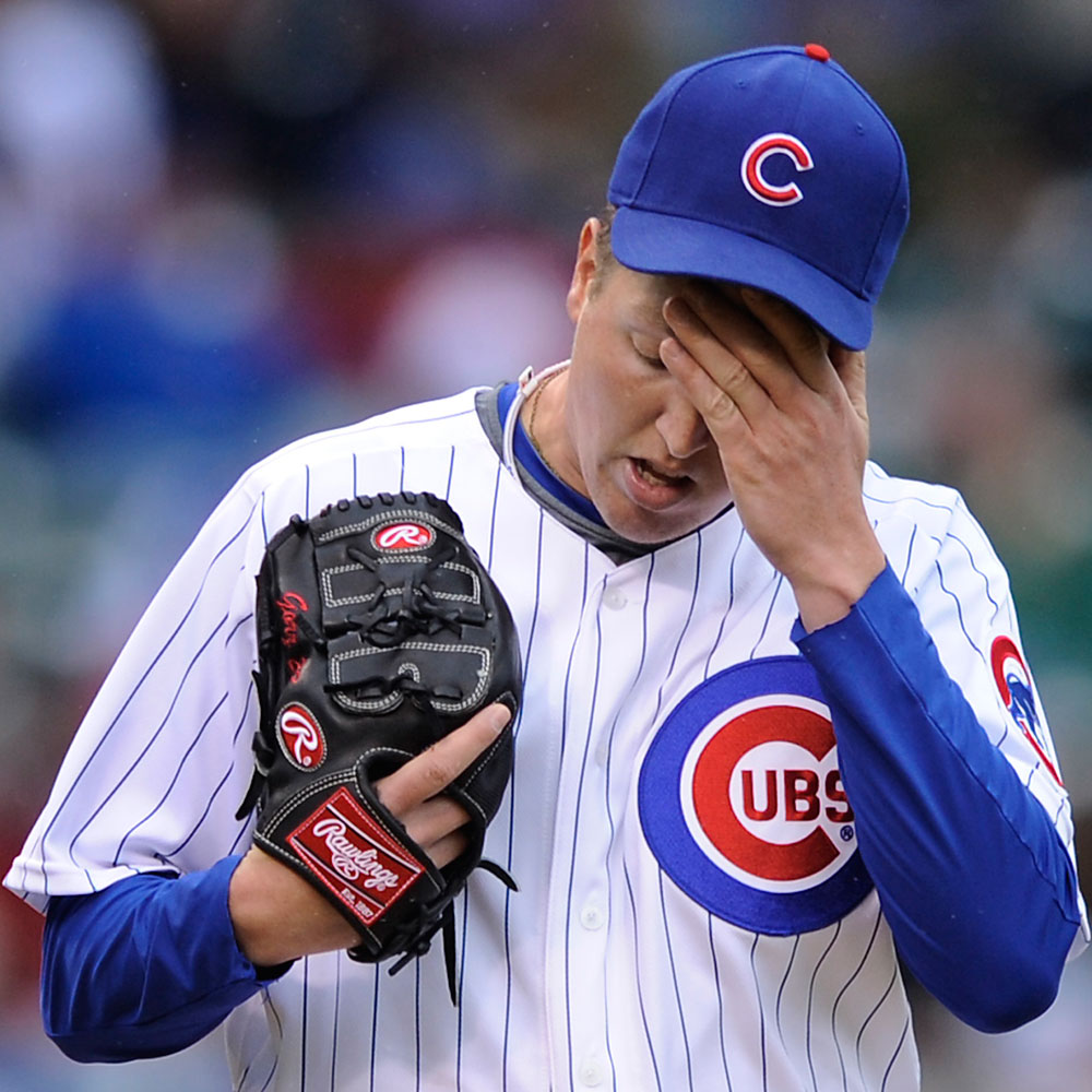 Chicago Cubs starting pitcher Tom Gorzelanny reacts to giving up four runs to the Arizona Diamondbacks during the third inning during a baseball game at Wrigley Field in Chicago, Friday, Oct. 2, 2009. (AP Photo/Paul Beaty)