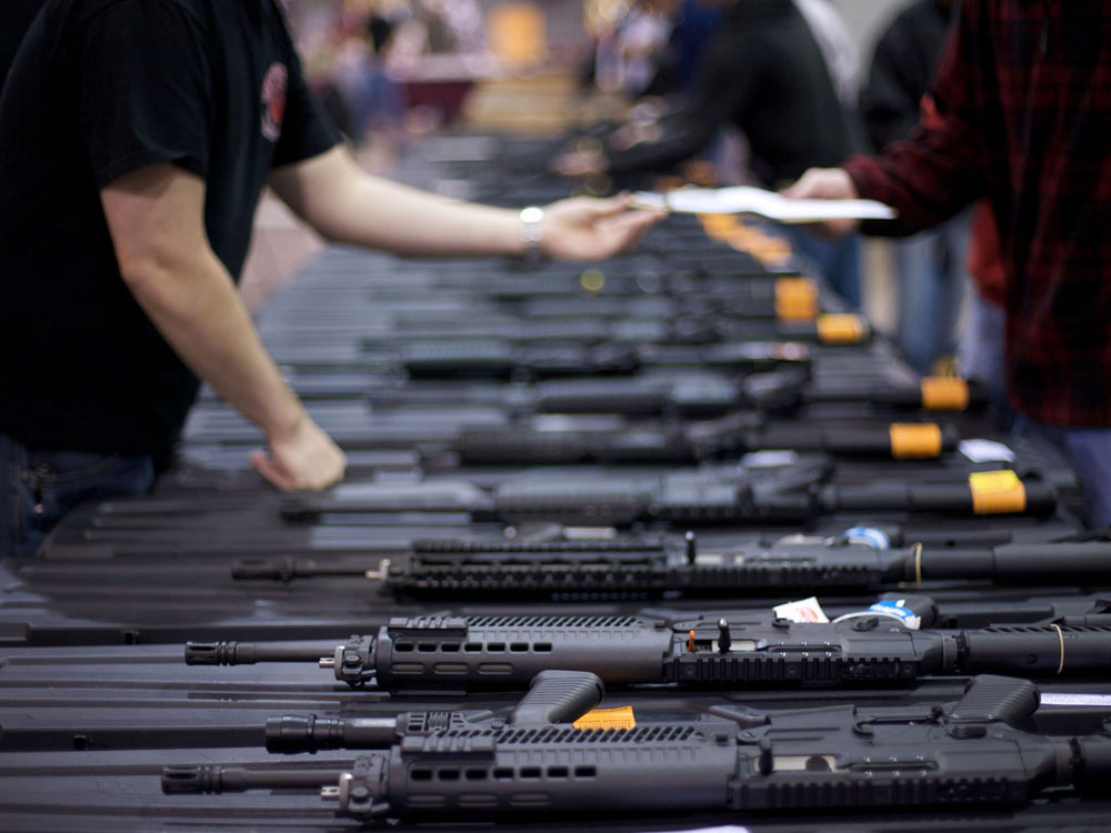 A row of weapons is seen at the Richmond Gun Show at the Richmond International Raceway on Sunday, March 30, 2008. (AP Photo/Casey Templeton)