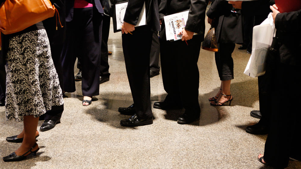 In this Sept. 10, 2009 photo, job hunters wait in line to meet with recruiters at a job fair in Philadelphia. (AP Photo/Matt Slocum)